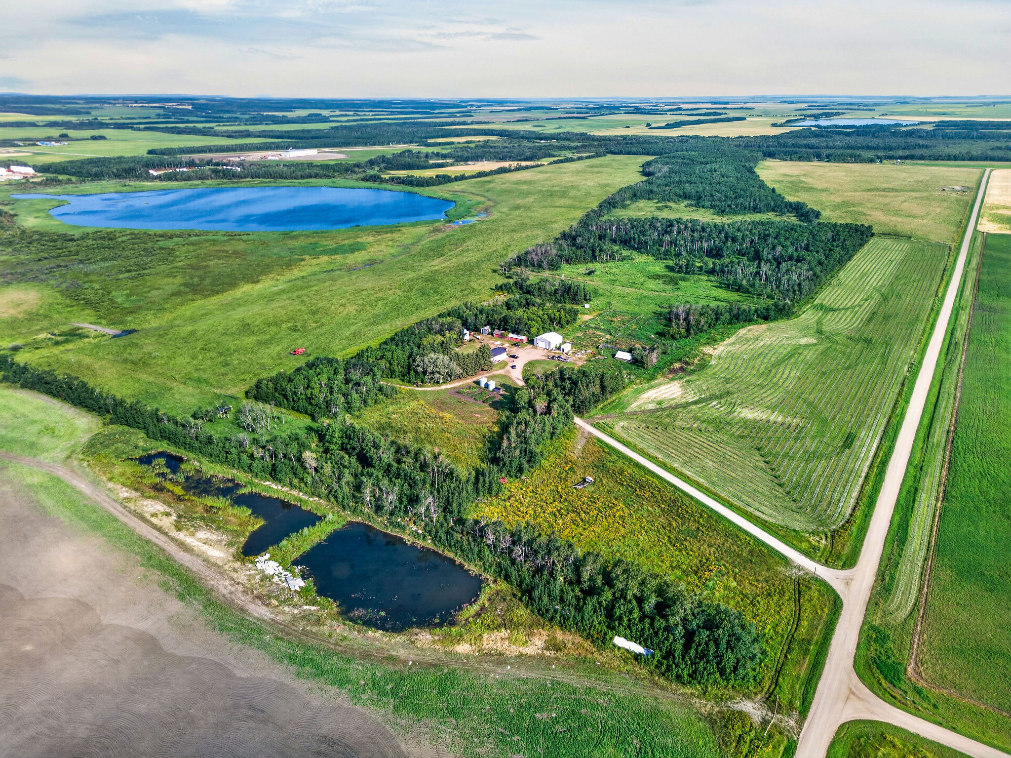 Wide aerial view of the Lefebvre land, yard site and road