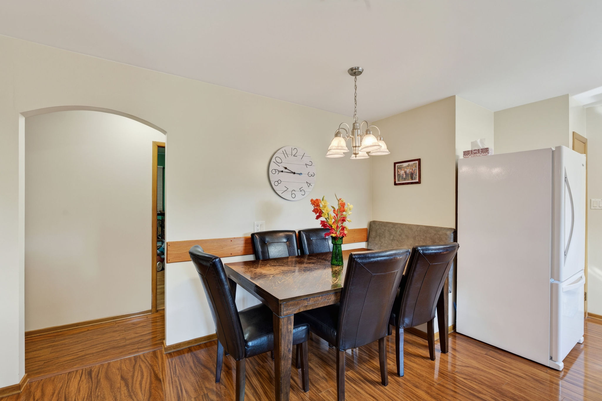 Dining area of the Lefebvre home with the kitchen beyond