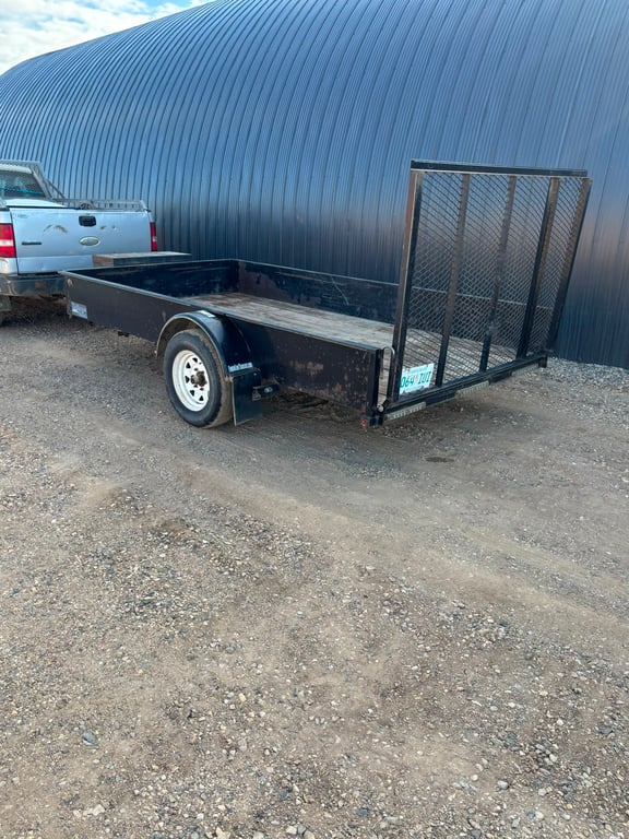 Utility trailer with ramp gate