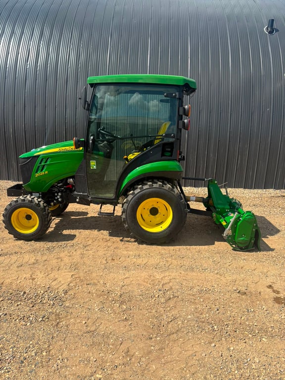 John Deere compact tractor with cab