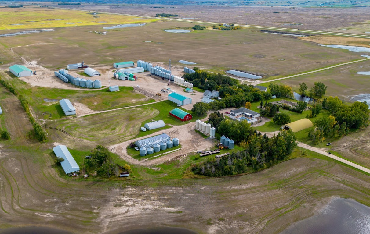 Wide aerial view of the Lumsden farm yard and surrounding fields