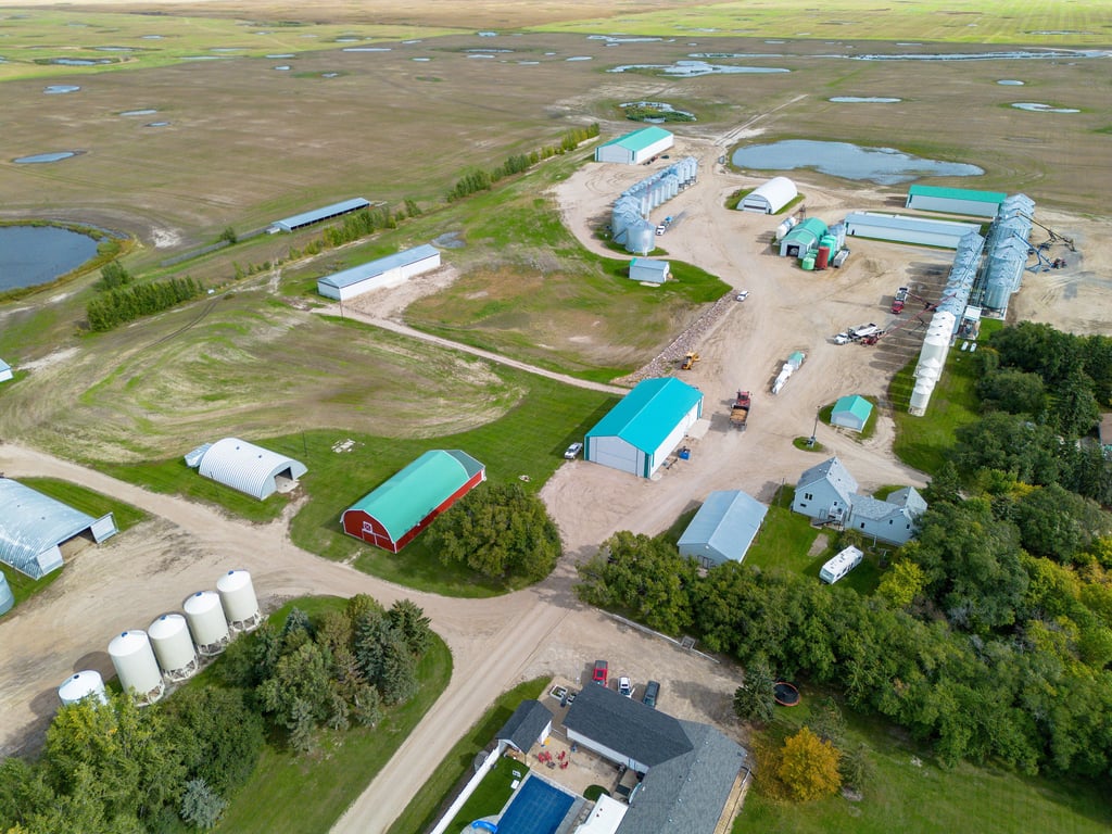 Aerial view of the Lumsden farm yard with homes, shops and bins
