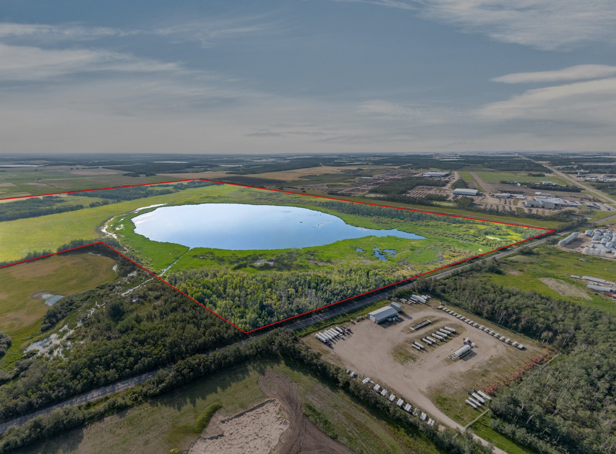 Aerial view of the Lefebvre land from the south with the lake and the three quarters outlined